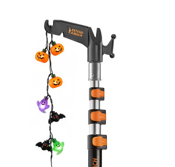 Extend-A-Reach 12 ft telescoping pole with utility hook, used to hang multicolor Christmas string lights safely from the ground