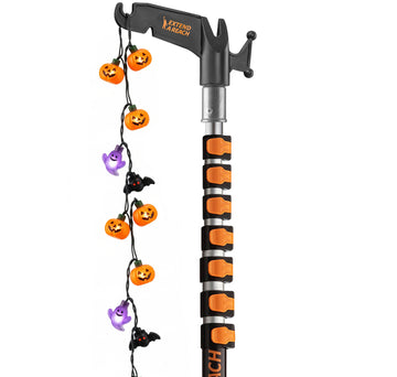 Extend-A-Reach 30 ft telescoping pole with utility hook, used to hang multicolor Halloween string lights safely from the ground
