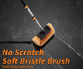 Extend-A-Reach soft bristle scrub brush with telescopic pole cleaning a dark surface, leaving a streak-free path. safe for cleaning cars, RVs and decks. Text: ‘No Scratch Soft Bristle Brush’.
