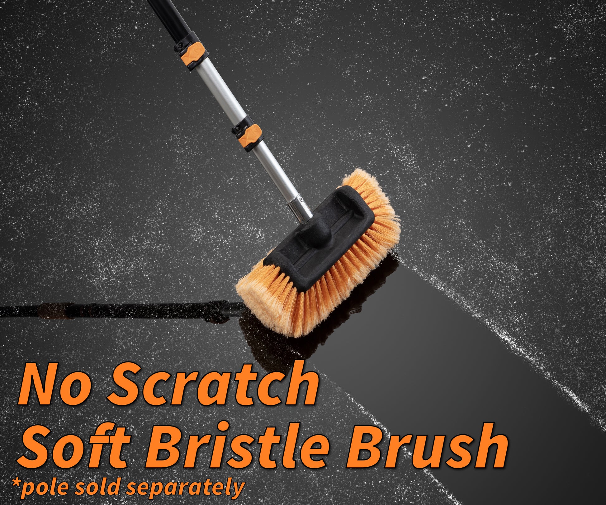 Extend-A-Reach soft bristle scrub brush with telescopic pole cleaning a dark surface, leaving a streak-free path. safe for cleaning cars, RVs and decks. Text: ‘No Scratch Soft Bristle Brush’."