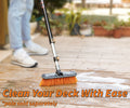 Extend-A-Reach telescoping extension pole with scrub brush cleaning a wooden deck. Ideal for exterior cleaning of decks and patios. Text: ‘Clean Your Deck With Ease’.
