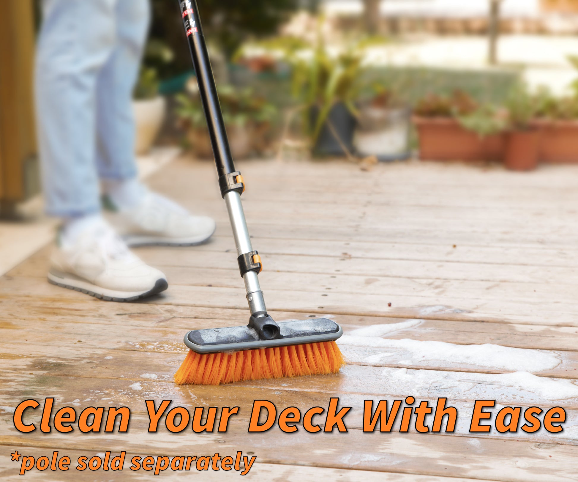 Extend-A-Reach telescoping extension pole with scrub brush cleaning a wooden deck. Ideal for exterior cleaning of decks and patios. Text: ‘Clean Your Deck With Ease’.