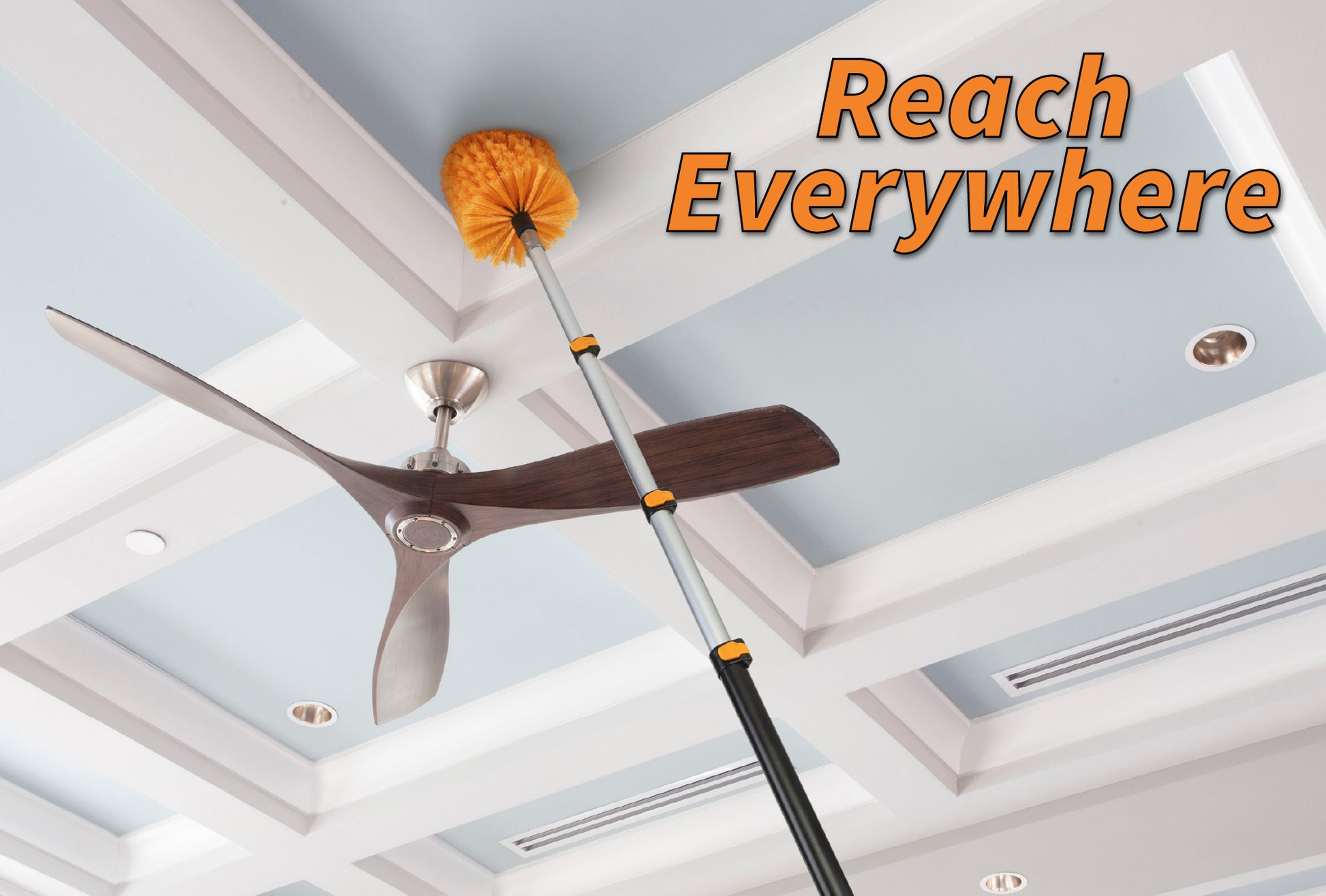 Extend-A-Reach telescoping extension pole with bright orange cobweb duster cleaning a high ceiling corner near a ceiling fan. Text on the image reads “Reach Everywhere,” highlighting the extended reach for removing spider webs and dust from ceilings, corners, and hard-to-reach areas without a ladder.