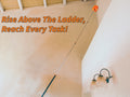 Extend-A-Reach telescoping extension pole with round cobweb duster attachment cleaning high outdoor corners and hard-to-reach areas near the ceiling. Text on image reads: