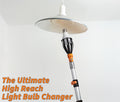 Extend-A-Reach telescoping light bulb changer pole with basket attachment replacing a high ceiling bulb in a pendant lamp fixture. Text on image reads: