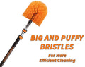 Close-up of the Extend-A-Reach cobweb duster with bright orange big and puffy bristles attached to a telescoping extension pole. Text on the image reads “BIG AND PUFFY BRISTLES For More Efficient Cleaning ” highlighting the thick bristle design for better spider web removal on high ceilings and outdoor corners.