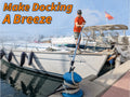 Man using an Extend-A-Reach telescoping boat hook pole to secure a sailboat to the dock with ease. The strong extendable docking pole attaches to a blue bollard with rope, making boat docking safe, fast, and hassle-free. Text on image reads: ‘Make Docking A Breeze.’
