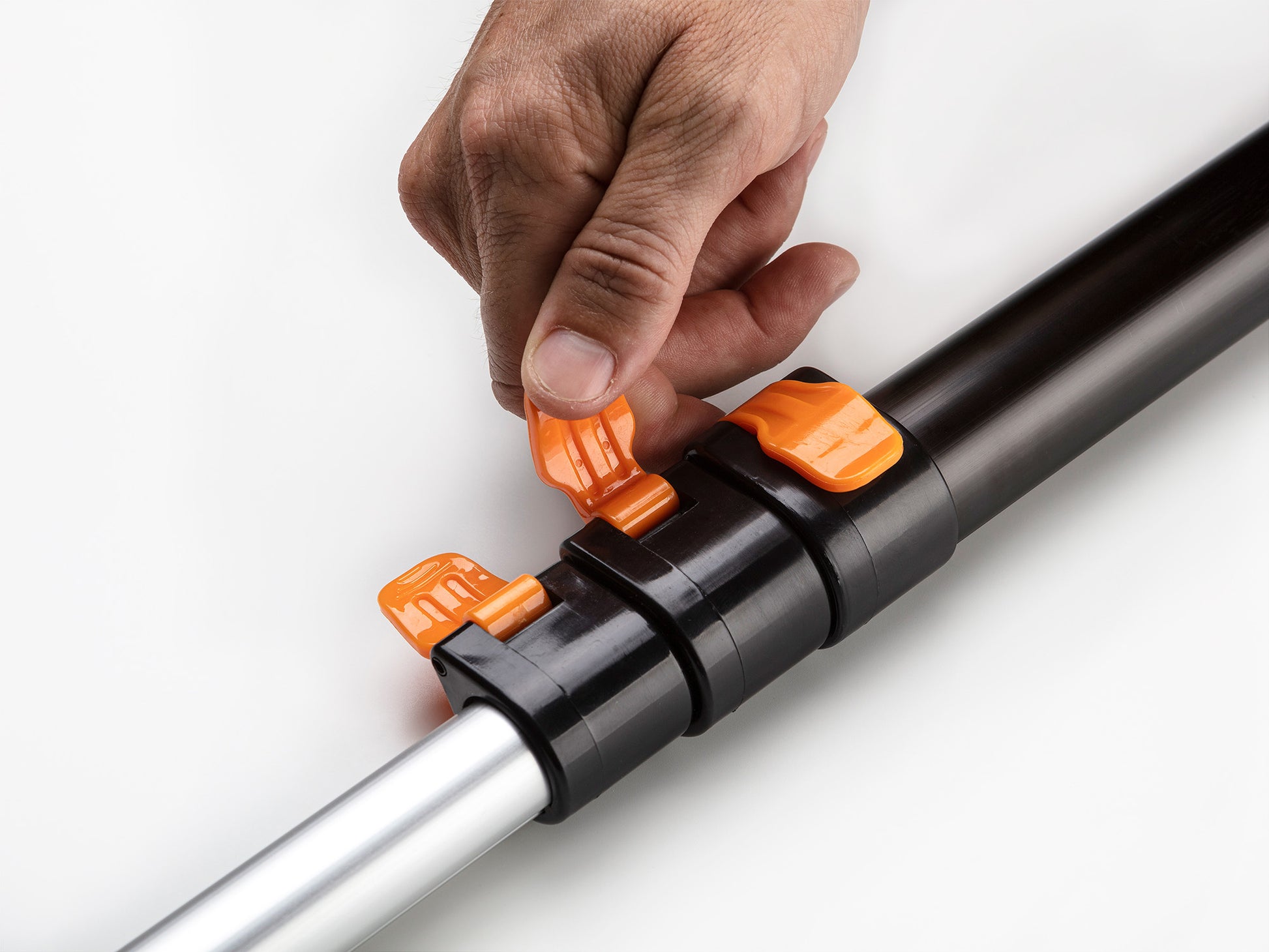 Close-up of the quick-release clamp on the Extend-A-Reach extendable pole, keeping the telescoping extension pole secure and easy to adjust